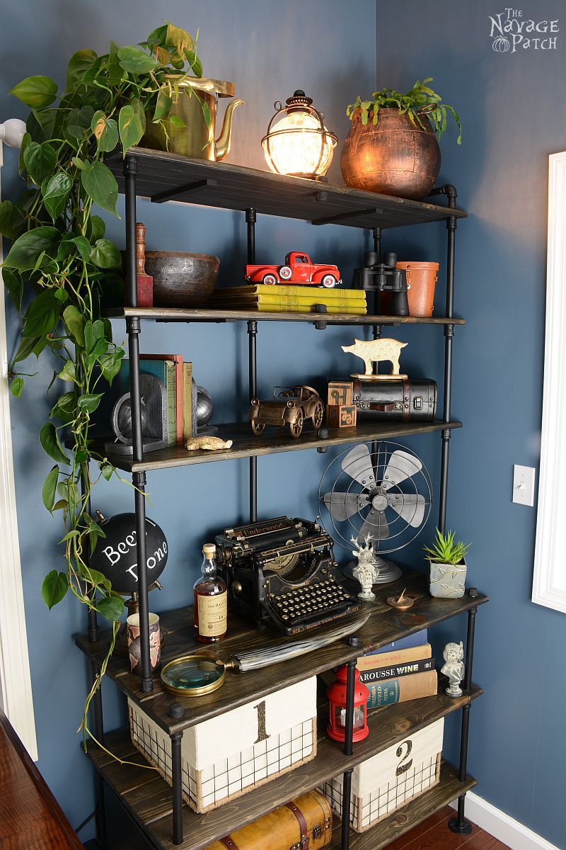 Of Pipe and Pine | DIY Industrial bookcase | DIY industrial shelves | DIY bookcase made with pipe and pine boards | Rustic wood shelves | Rustic bookcase | How to make a bookcase | Office storage solution | Simple organization and storage | DIY Industrial furniture | TheNavagePatch.com