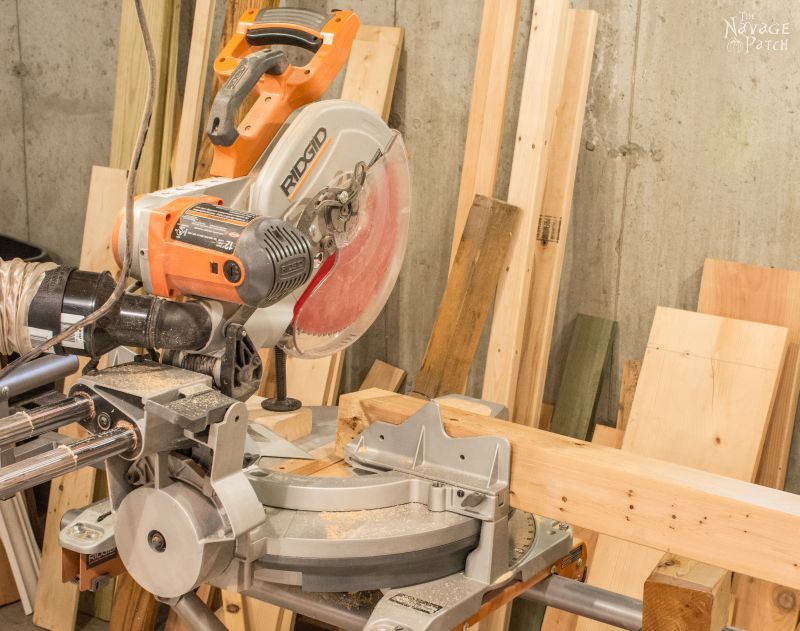 4 x 4 lumber resting on a miter saw