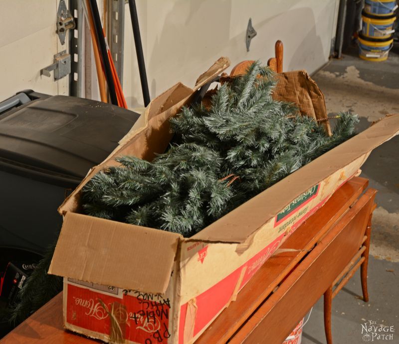 faux christmas tree branches in a box