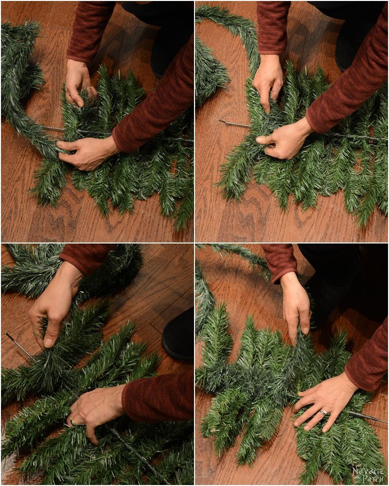 wrapping garland around some artificial christmas tree branches