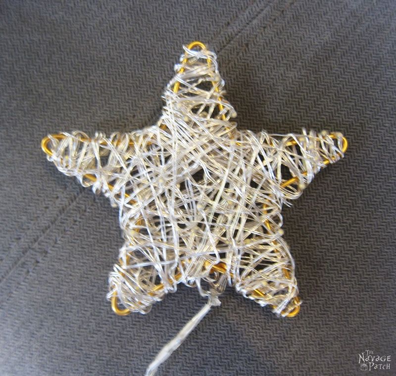 small wire star wrapped with string lights