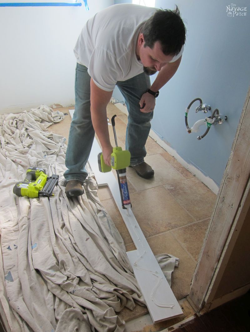 Guest Bathroom Renovation | How to install a toilet bowl | How to install wainscoting | How to install board and batten | DIY toilet bowl installation | DIY board and batten wainscoting | How to paint trim with no brush marks | How to paint windows | How to fix walls like a pro | DIY wall demolition | Best paint for bathrooms | Benjamin Moore Advance Paint | Before & After | TheNavagePatch.com