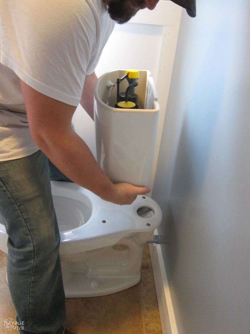 Guest Bathroom Renovation | How to install a toilet bowl | How to install wainscoting | How to install board and batten | DIY toilet bowl installation | DIY board and batten wainscoting | How to paint trim with no brush marks | How to paint windows | How to fix walls like a pro | DIY wall demolition | Best paint for bathrooms | Benjamin Moore Advance Paint | Before & After | TheNavagePatch.com