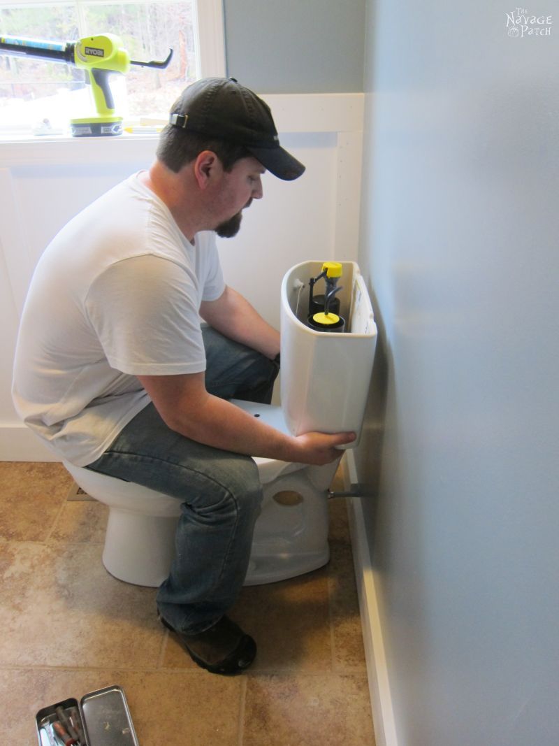 Guest Bathroom Renovation | How to install a toilet bowl | How to install wainscoting | How to install board and batten | DIY toilet bowl installation | DIY board and batten wainscoting | How to paint trim with no brush marks | How to paint windows | How to fix walls like a pro | DIY wall demolition | Best paint for bathrooms | Benjamin Moore Advance Paint | Before & After | TheNavagePatch.com