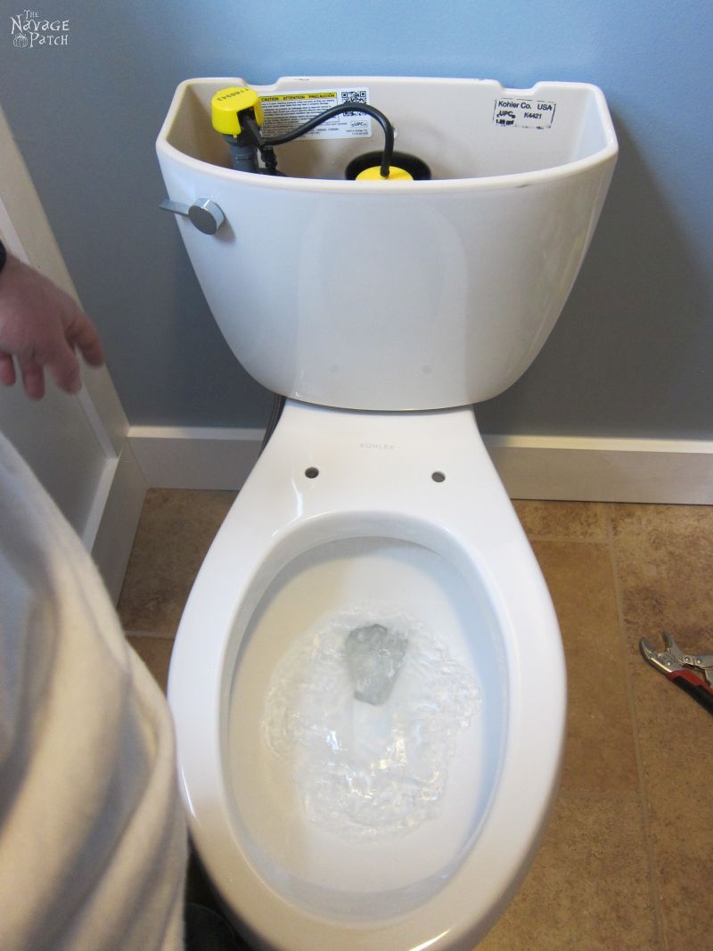 Guest Bathroom Renovation | How to install a toilet bowl | How to install wainscoting | How to install board and batten | DIY toilet bowl installation | DIY board and batten wainscoting | How to paint trim with no brush marks | How to paint windows | How to fix walls like a pro | DIY wall demolition | Best paint for bathrooms | Benjamin Moore Advance Paint | Before & After | TheNavagePatch.com