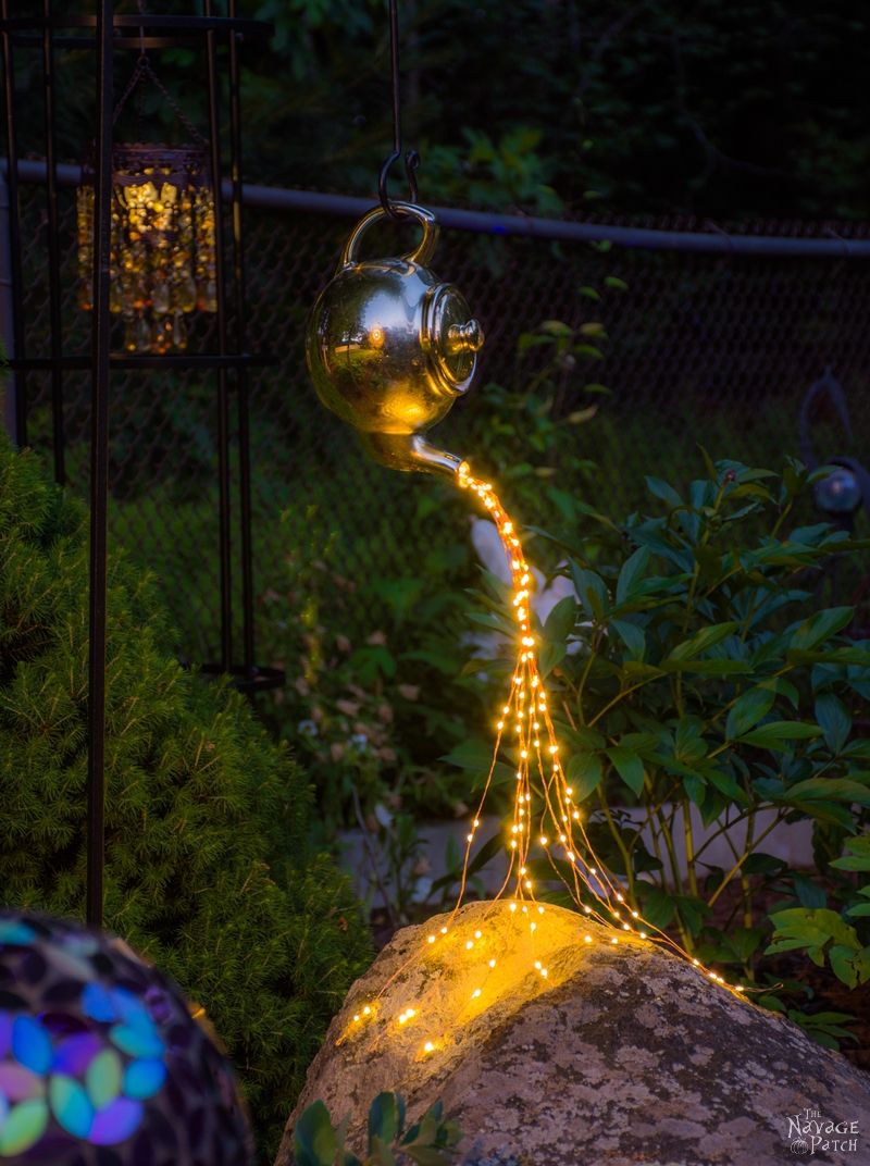 DIY Spilling Solar fairy Lights (Teapot Lights) in a garden at night
