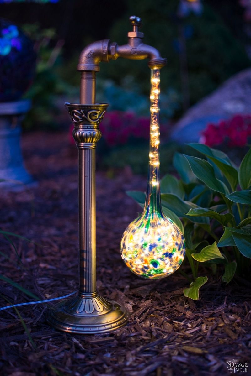 solar garden light next to a hosta