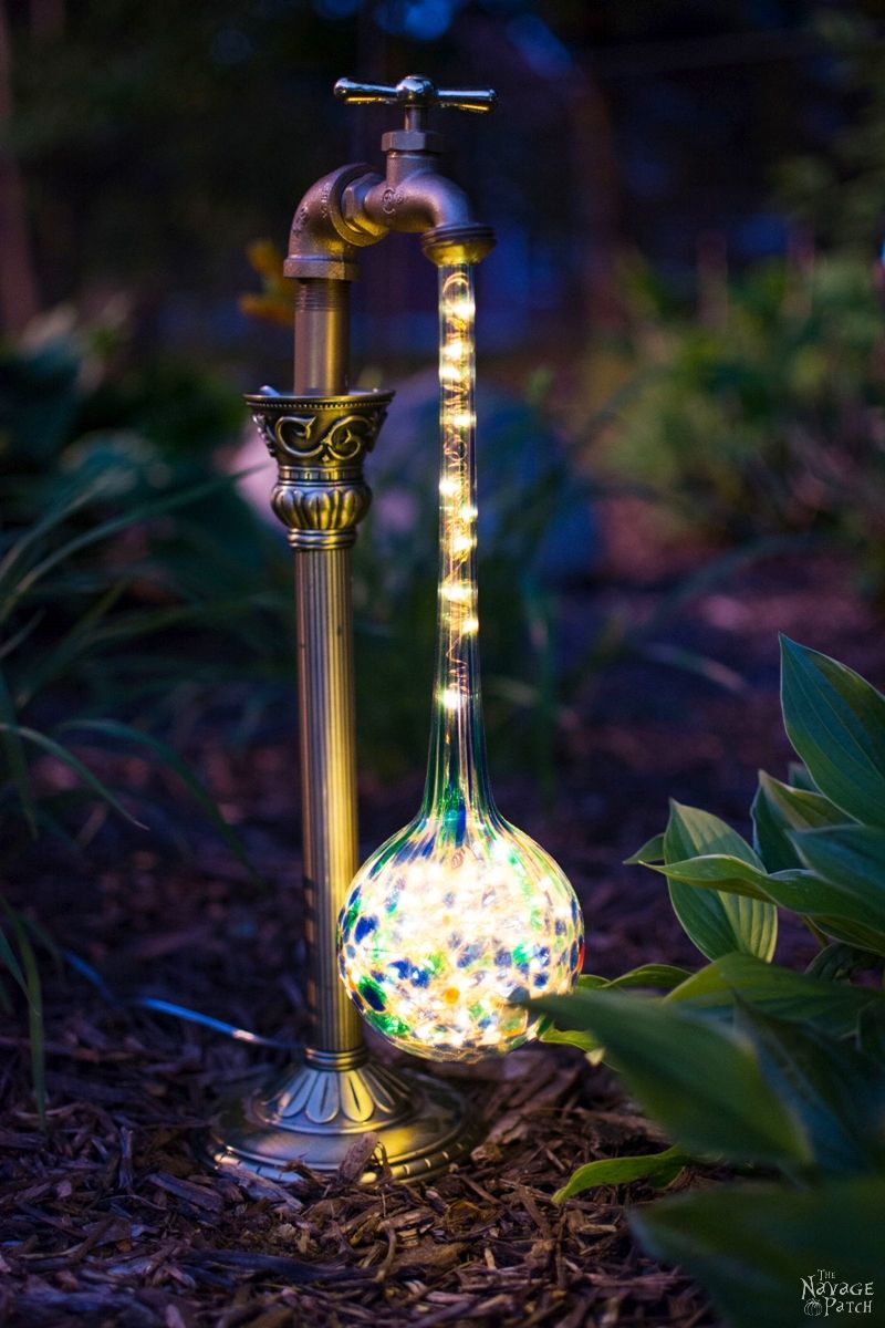 DIY Waterdrop Solar Lights | Easy, budget friendly and one of a kind DIY backyard ornaments and landscape lights | Upcycled candle sticks | Upcycled plant watering globes | Step-by-step tutorial for DIY waterdrop solar lights | DIY whimsical garden lights | Before & After | TheNavagePatch.com