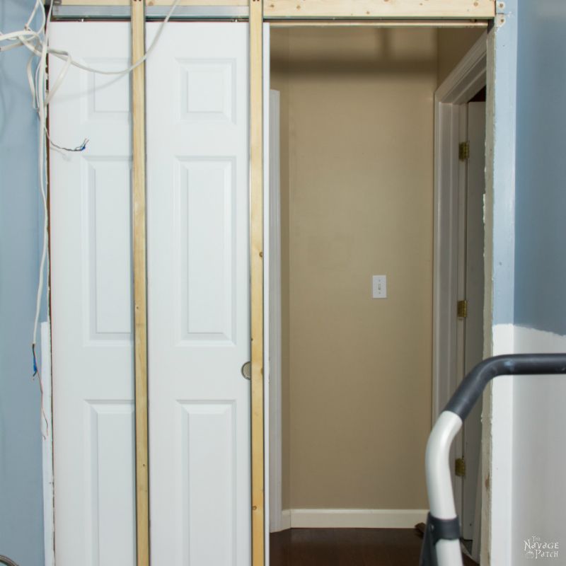 Guest Bathroom Renovation | DIY pocket door installation | How to install a pocket door | How to cut a door opening in a wall | How to make a door opening |How to paint a door | Before and After | TheNavagePatch.com