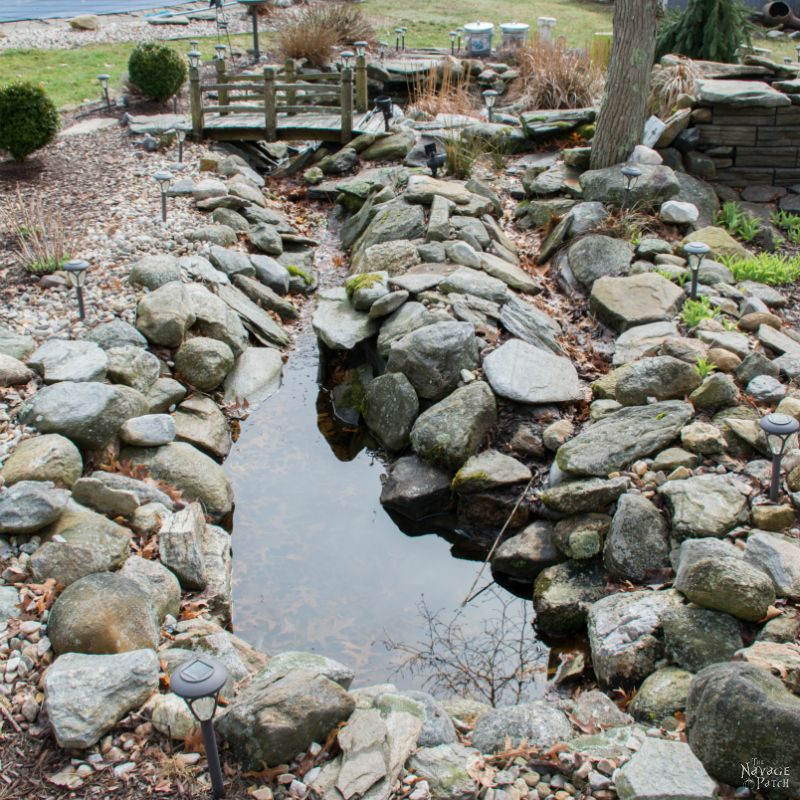 The Pond Project | DIY pond and backyard makeover | DIY garden edging | How to lay edge stones | How to edge garden beds | Tips on landscaping | DIY garden decor | DIY koi pond lining | How to maintain a koi pond | Spring planting and transplanting | Pond and backyard reveal | Before & After | TheNavagePatch.com