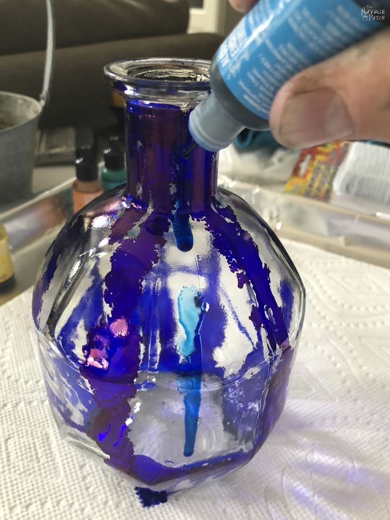 Alcohol Ink Bottle Lights | How paint glass with alcohol ink | How to use alcohol ink | DIY bottle lights | Repurposed bottle decoration | Painted bottle lights | Alcohol ink tutorial | #TheNavagePatch #DIY #easydiy #alcoholink #tutorial #Upcycled #Repurposed #gardenlights #Bottlecrafts #Upcycledbottle #HomeDecor #diycrafts #outdoors #summerdecor | TheNavagePatch.com