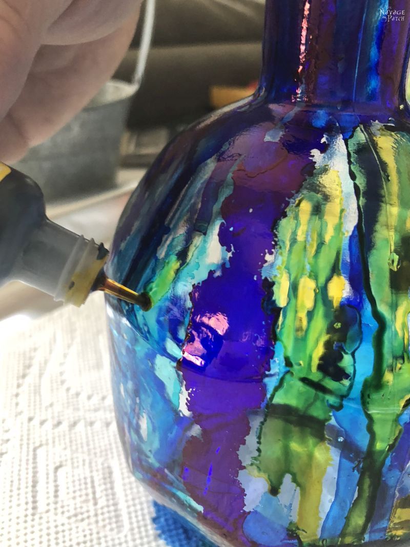 Alcohol Ink Bottle Lights | How paint glass with alcohol ink | How to use alcohol ink | DIY bottle lights | Repurposed bottle decoration | Painted bottle lights | Alcohol ink tutorial | #TheNavagePatch #DIY #easydiy #alcoholink #tutorial #Upcycled #Repurposed #gardenlights #Bottlecrafts #Upcycledbottle #HomeDecor #diycrafts #outdoors #summerdecor | TheNavagePatch.com