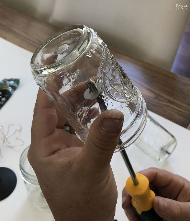 Solar Mason Jar Lights | DIY outdoor solar lights | Upcycled mason jar solar lights | How to drill glass easily | How to easily drill ceramic | DIY outdoor solar sconces from mason jars | DIY outdoor sconces | DIY Porch lighting | Repurposed mason jars | #TheNavagePatch #DIY #SolarLights #MasonJars #easydiy #masonjarlights #Lighting #Upcycled # Repurposed #HowTo #CurbAppeal #Porchdecor #farmhouse #farmhousestyle | TheNavagePatch.com