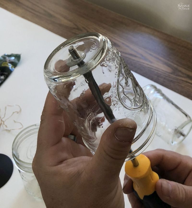 Solar Mason Jar Lights | DIY outdoor solar lights | Upcycled mason jar solar lights | How to drill glass easily | How to easily drill ceramic | DIY outdoor solar sconces from mason jars | DIY outdoor sconces | DIY Porch lighting | Repurposed mason jars | #TheNavagePatch #DIY #SolarLights #MasonJars #easydiy #masonjarlights #Lighting #Upcycled # Repurposed #HowTo #CurbAppeal #Porchdecor #farmhouse #farmhousestyle | TheNavagePatch.com