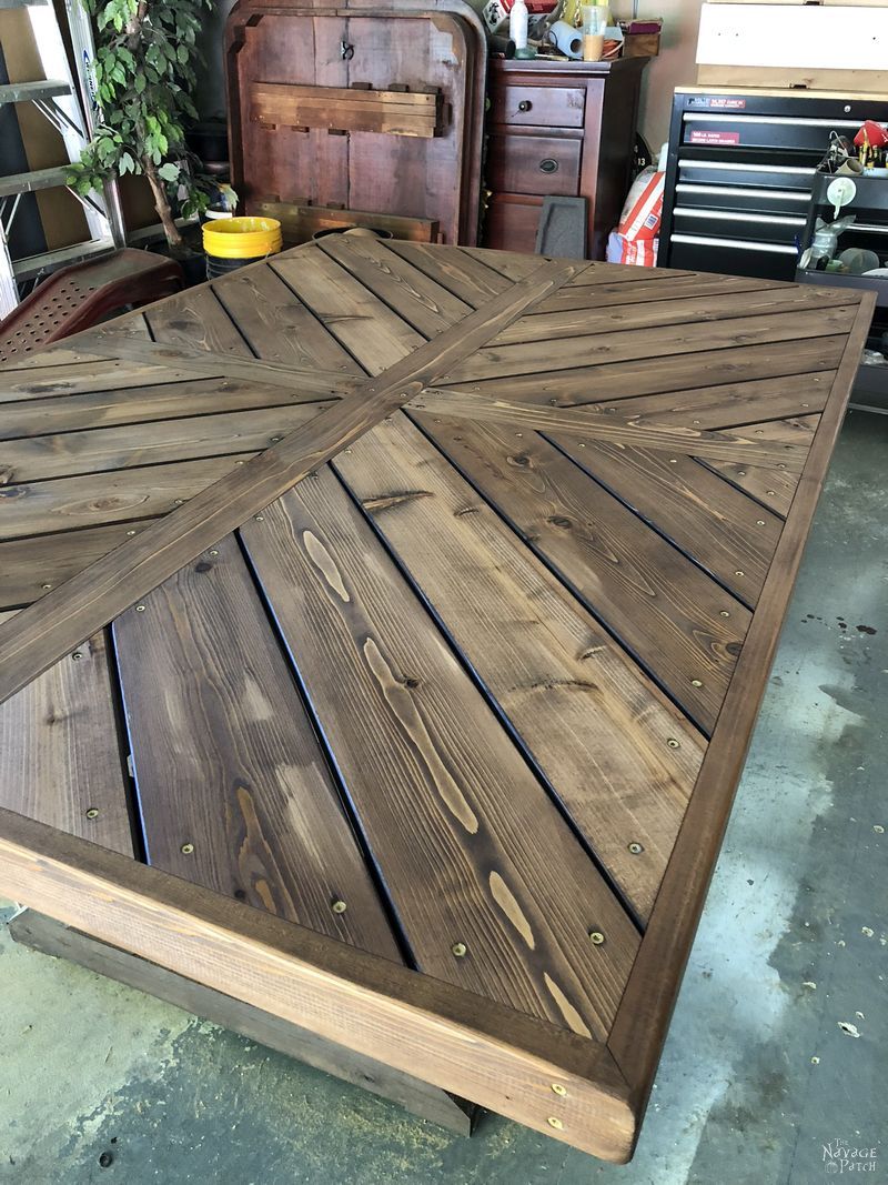 DIY farmhouse table with herringbone table top | DIY trestle table with free plans| How to make a herringbone table top | How to get the weathered wood look with stain | How to build an outdoor dining table | DIY dining table with free plans | How to get the aged wood look with stain | #TheNavagePatch #diy #farmhouse #HowTo #diyfurniture #freeplans #myrustoleum | TheNavagePatch.com