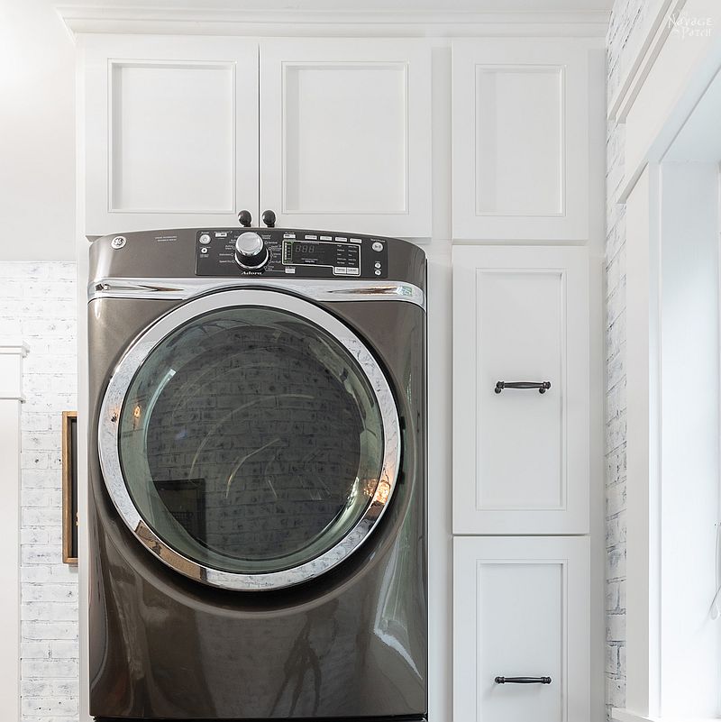 Laundry Room Cabinet with Pull-Out Shelves | DIY pull-out shelf | How to make sliding shelves for laundry room cabinet | DIY slide-out shelf and cabinet tutorial | DIY Laundry Room cabinet with Dog Feeding Station | How to install CabinetNow doors | Best paint for cabinets | #TheNavagePatch #diy #Laundry #organization #Cabinet #Tutorial #HowTo #Paintedfurniture #diyfurniture #dogfeedingstation | TheNavagePatch.com