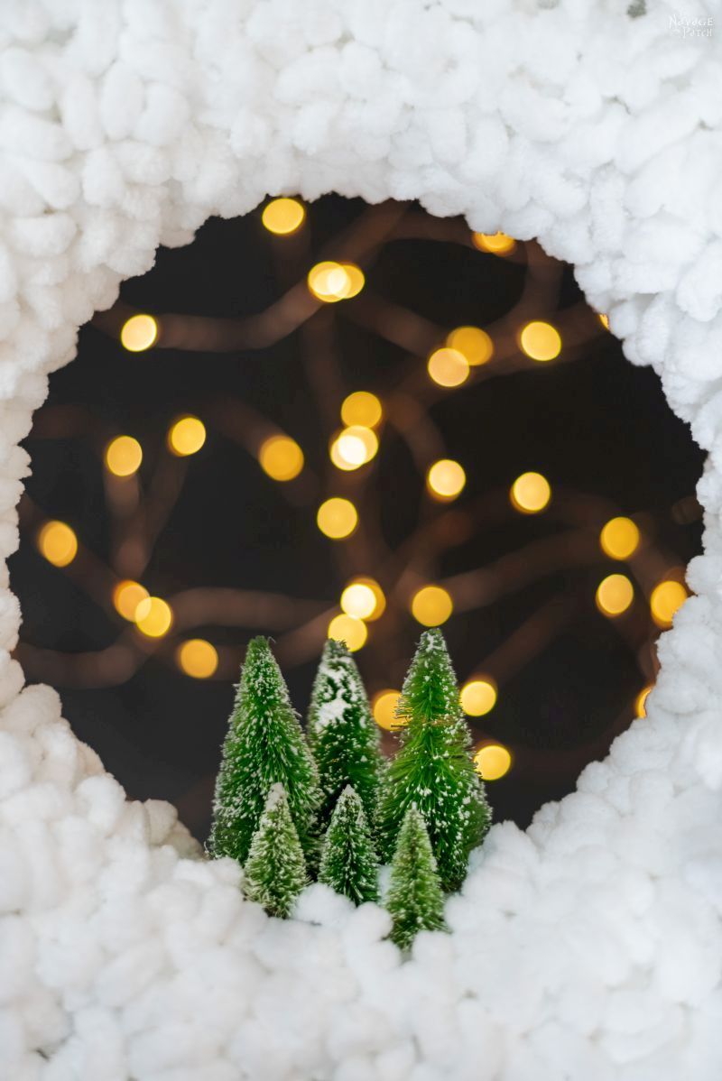 cropped photo of wreath with fairy lights in the background