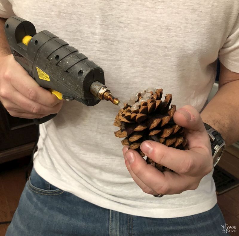 DIY Lighted Pine Cone Star | How to make a pine cone star | Easy pine cone Christmas decorations | Upcycled pine cone crafts | How to make a yardstick star in less than 5 minutes | #TheNavagePatch #DIY #easydiy #pinecone #Upcycled #Repurposed #Christmas # starpattern #Holidaydecor #DIYChristmas #yardstick #Holidays #star | TheNavagePatch.com