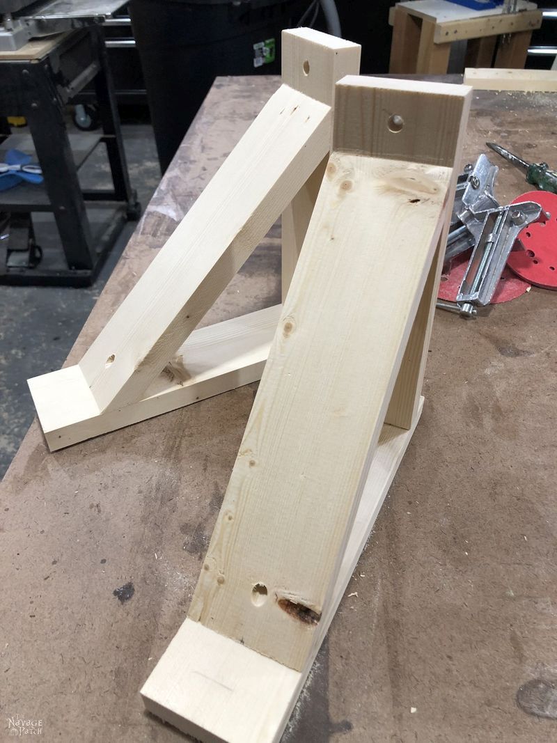 two unfinished diy corbel sconces