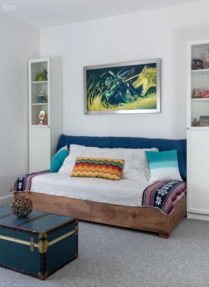 diy daybed between two tall bookcases