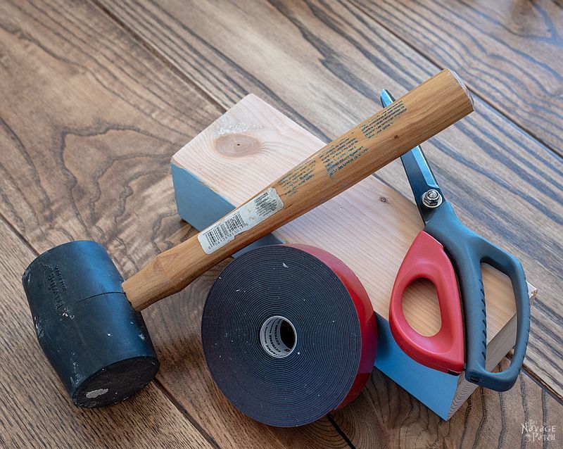 4x4, rubber mallet, double-sided tape and scissors on a table