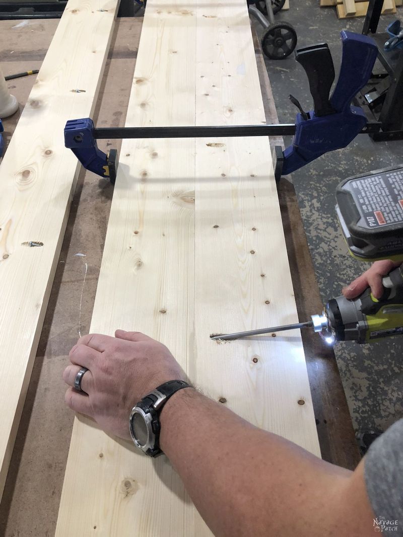 man attaching two boards together with pocket screws