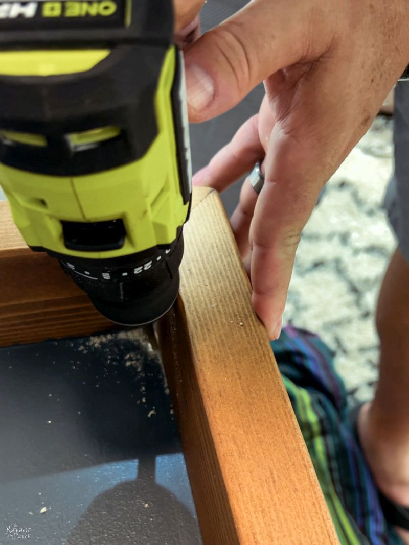 drilling a wire hole in a guitar display case