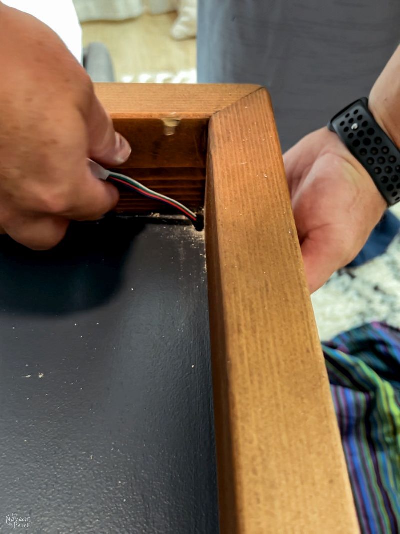 feeding lighting wire through a guitar display case