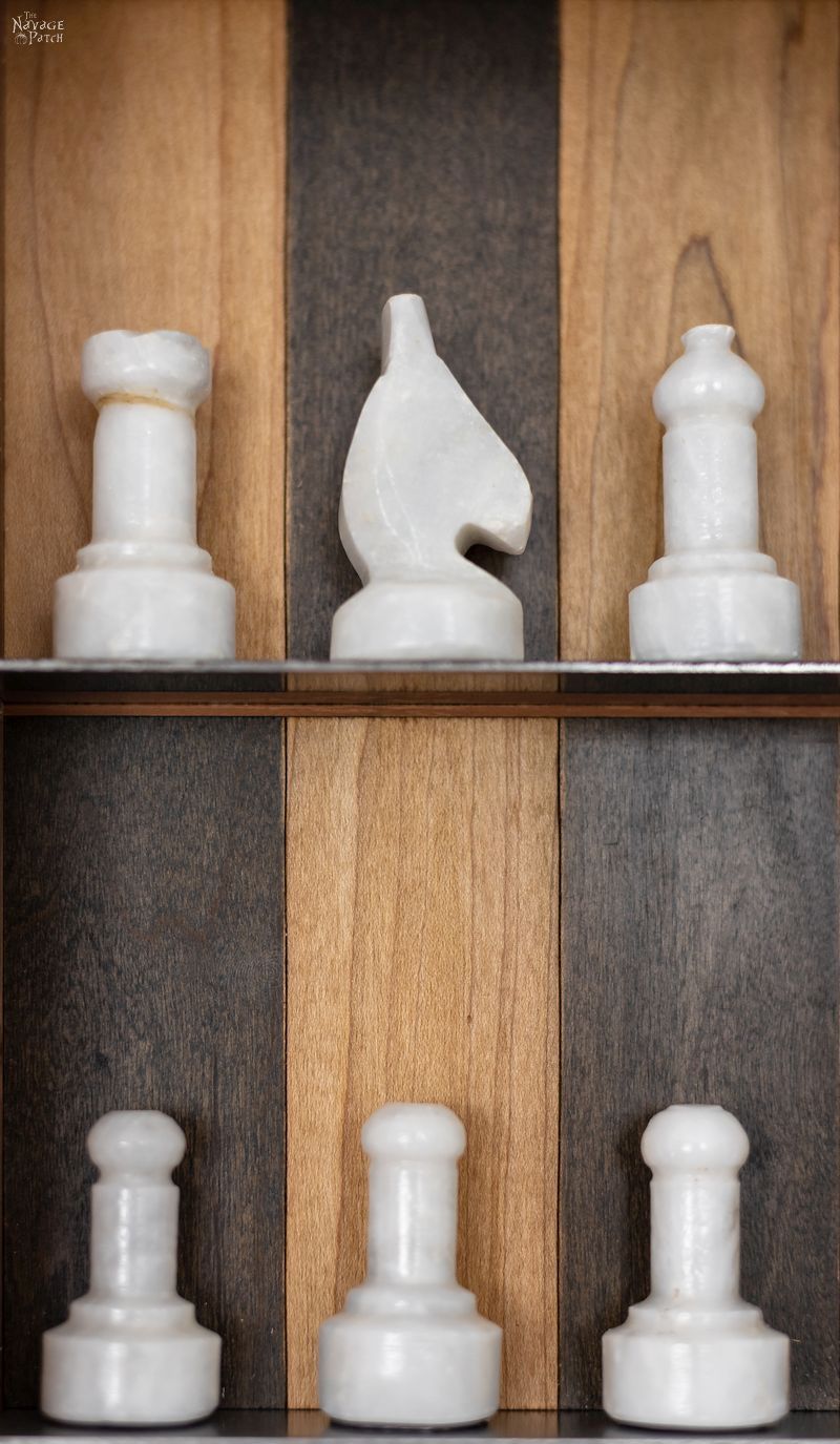 chess pieces on a vertical chess board