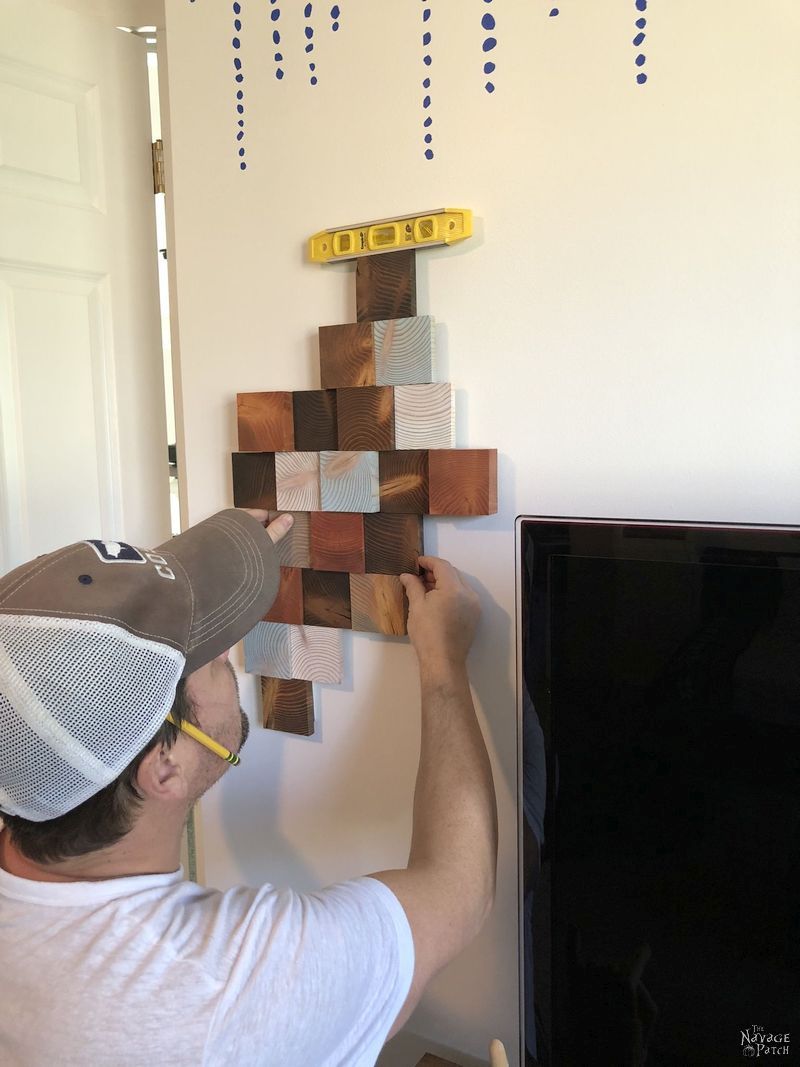 man hanging diy wood wall art