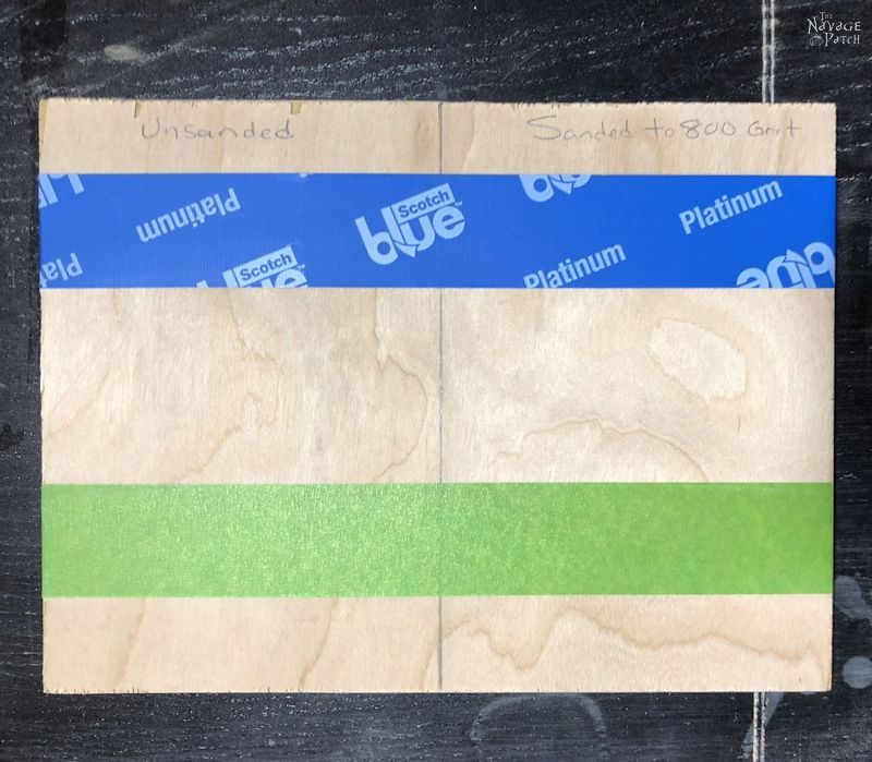 piece of plywood with green and blue tape on it