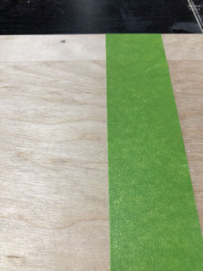 green tape on plywood