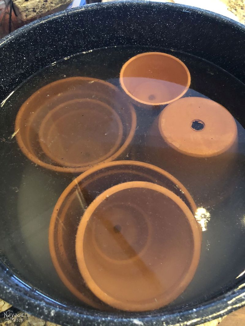 terra cotta pots submerged in salt water