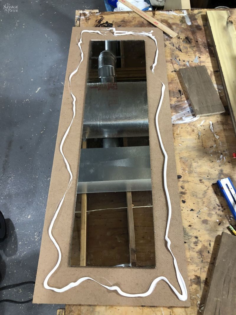 making a diy rustic mirror frame 