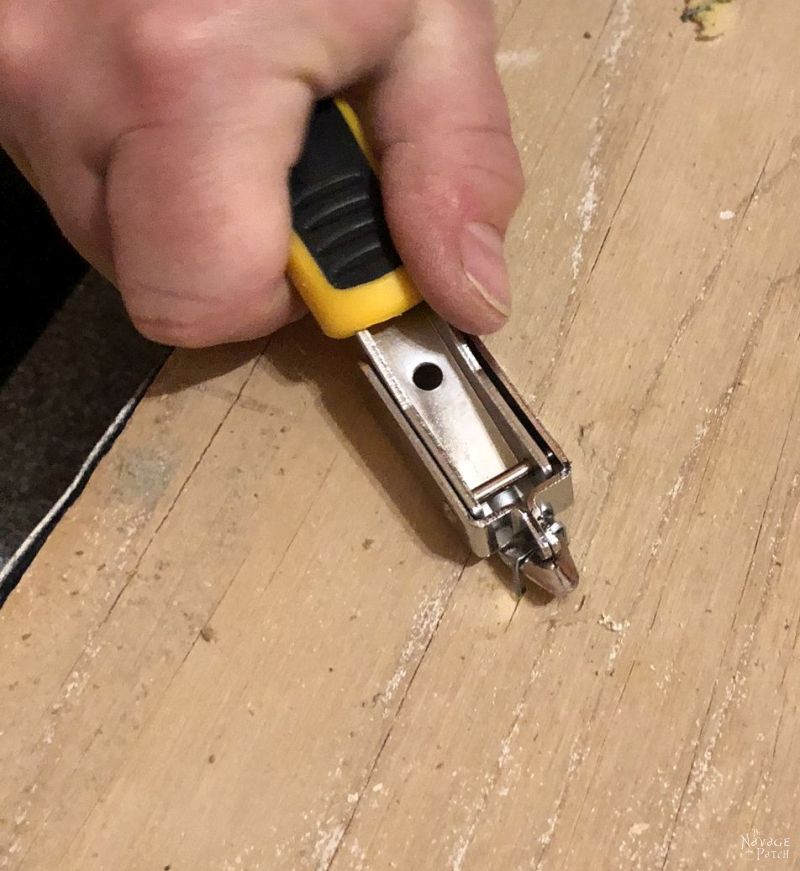 lifting carpet staples with a construction staple remover