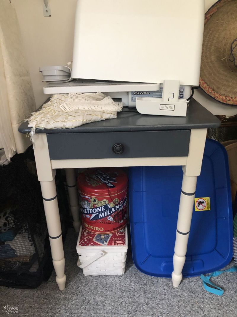 side table in a messy closet