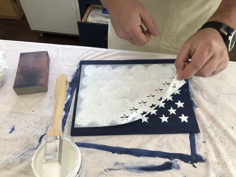 peeling back a star stencil