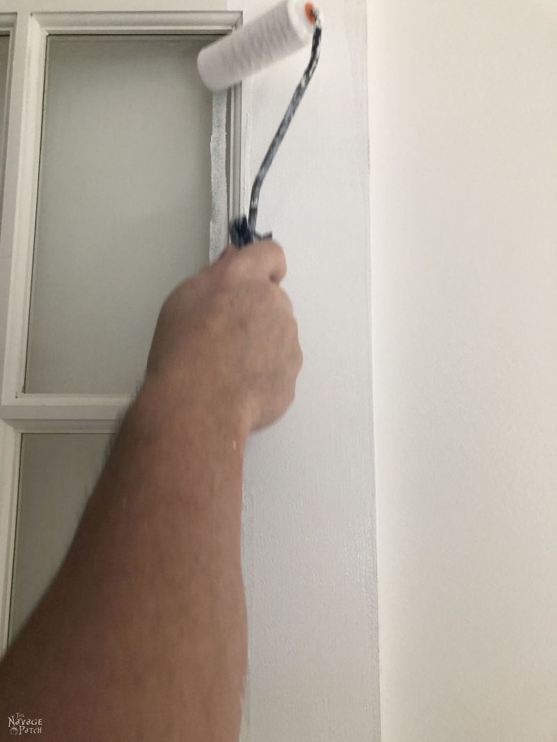 painting a french door with a foam roller