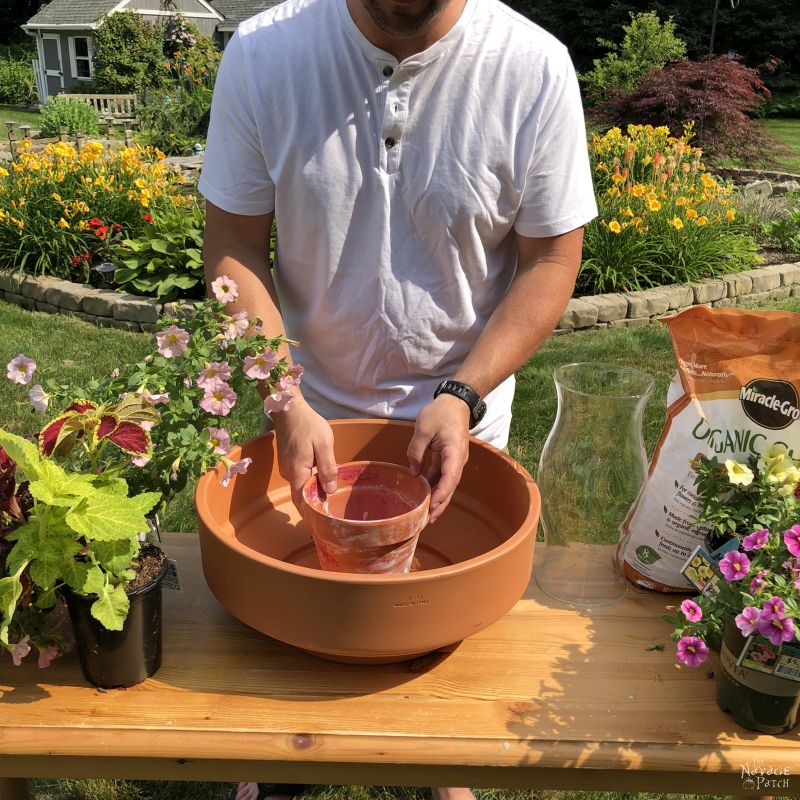 placing a smaller clay pot inside a larger one