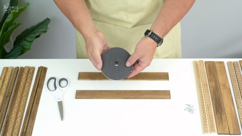 holding a roll of magnetic tape