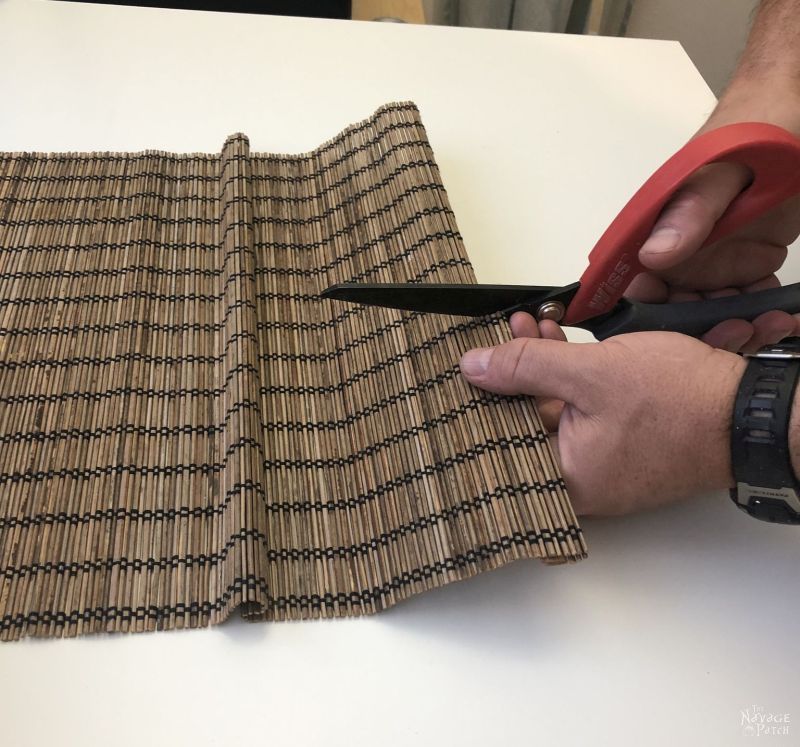 cutting a bamboo placemat for a coffee can repurpose