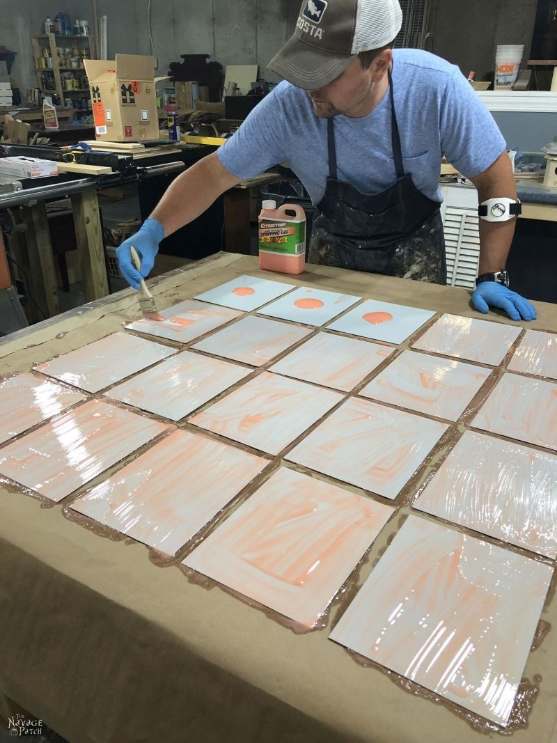 brushing stripping gel onto the backs of mirrors