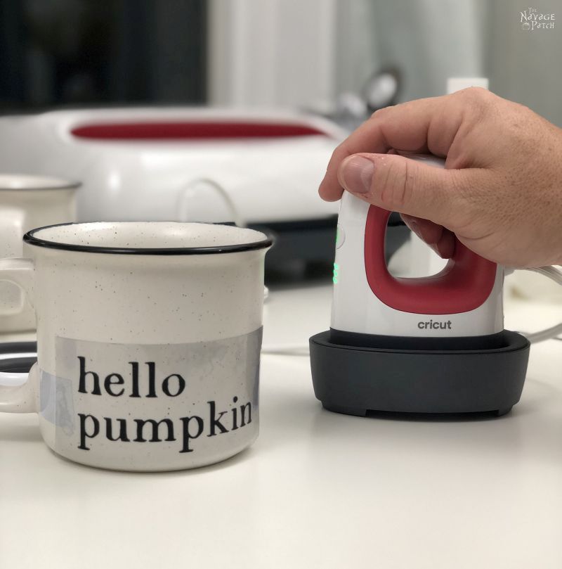 cricut easypress mini and a mug on a table