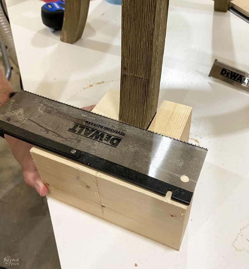 using a flush cut saw on a barstool leg