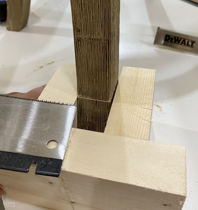 using a flush cut saw on a barstool leg