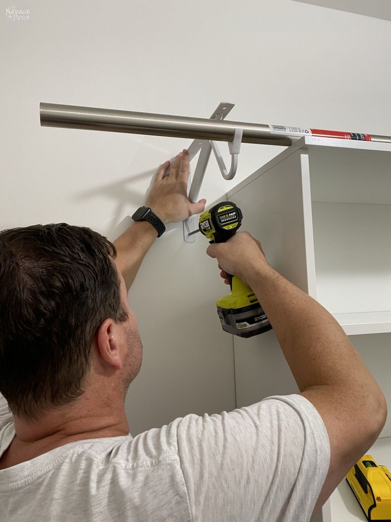 installing hanger rod in a closet