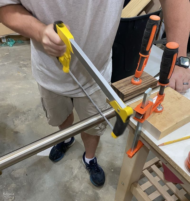cutting a hanger rod with a hacksaw