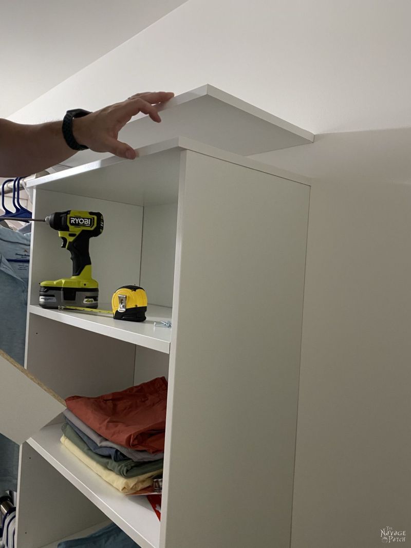 installing a shelf in a master closet