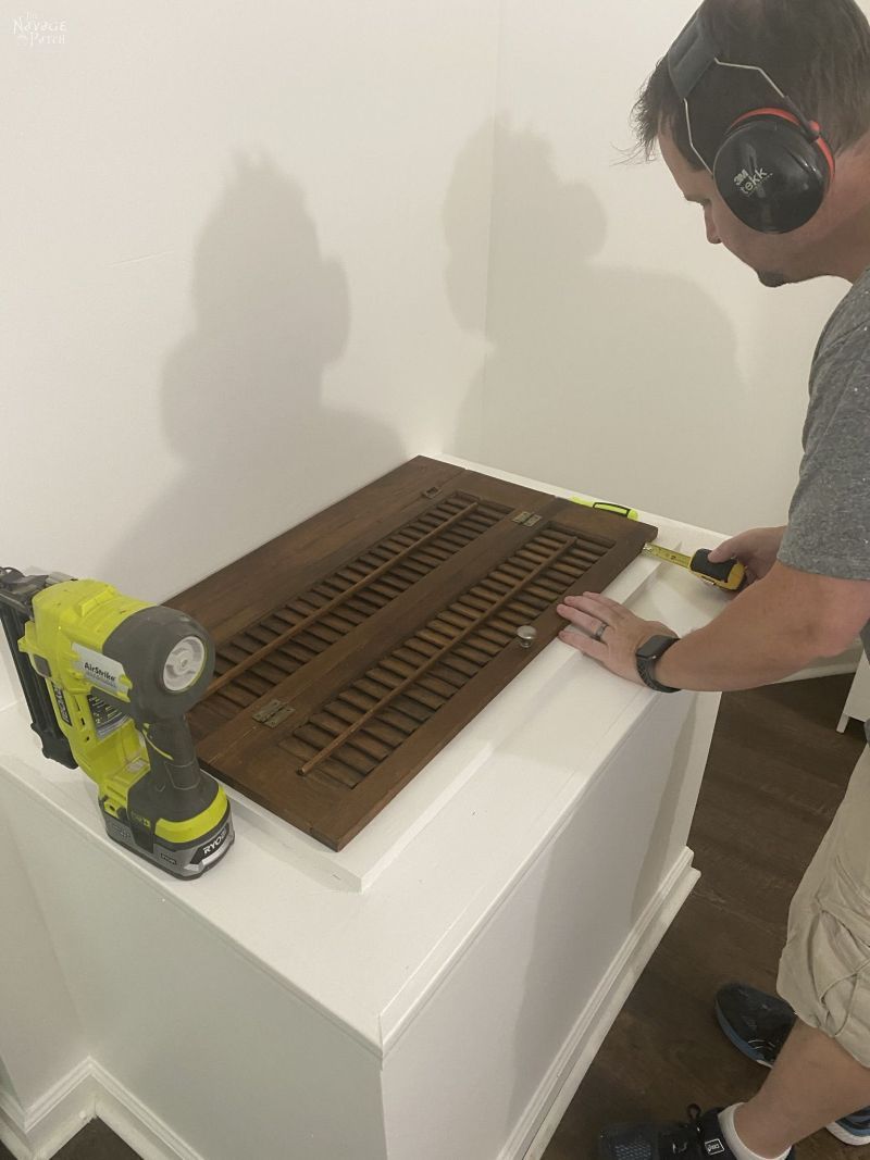 installing a repurposed plantation shutter laundry chute lid