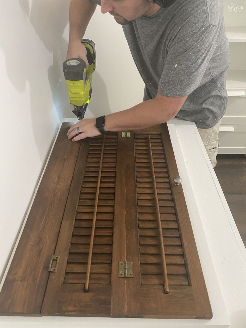 installing a repurposed plantation shutter laundry chute lid